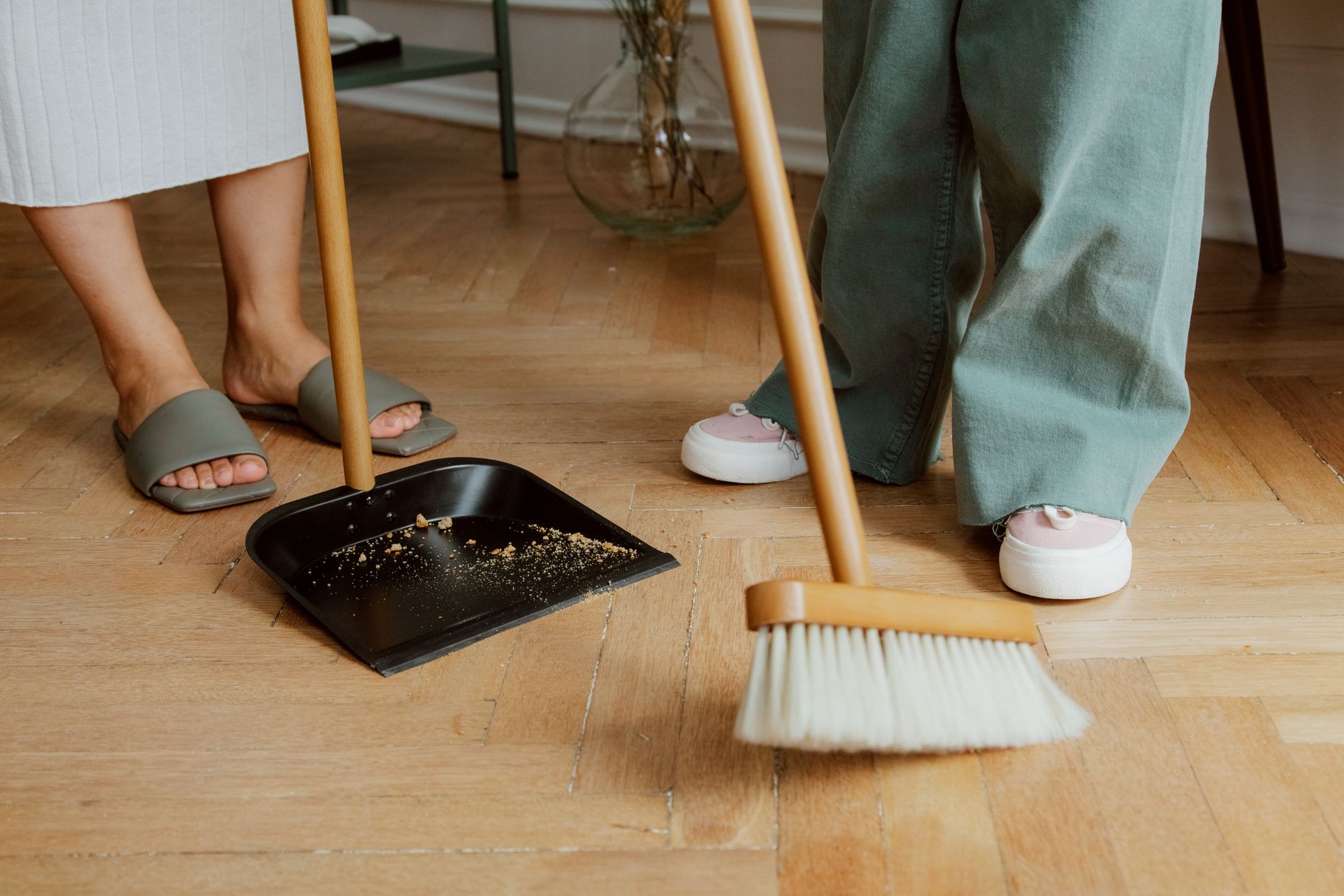 mother and daughter cleaning wooden floor