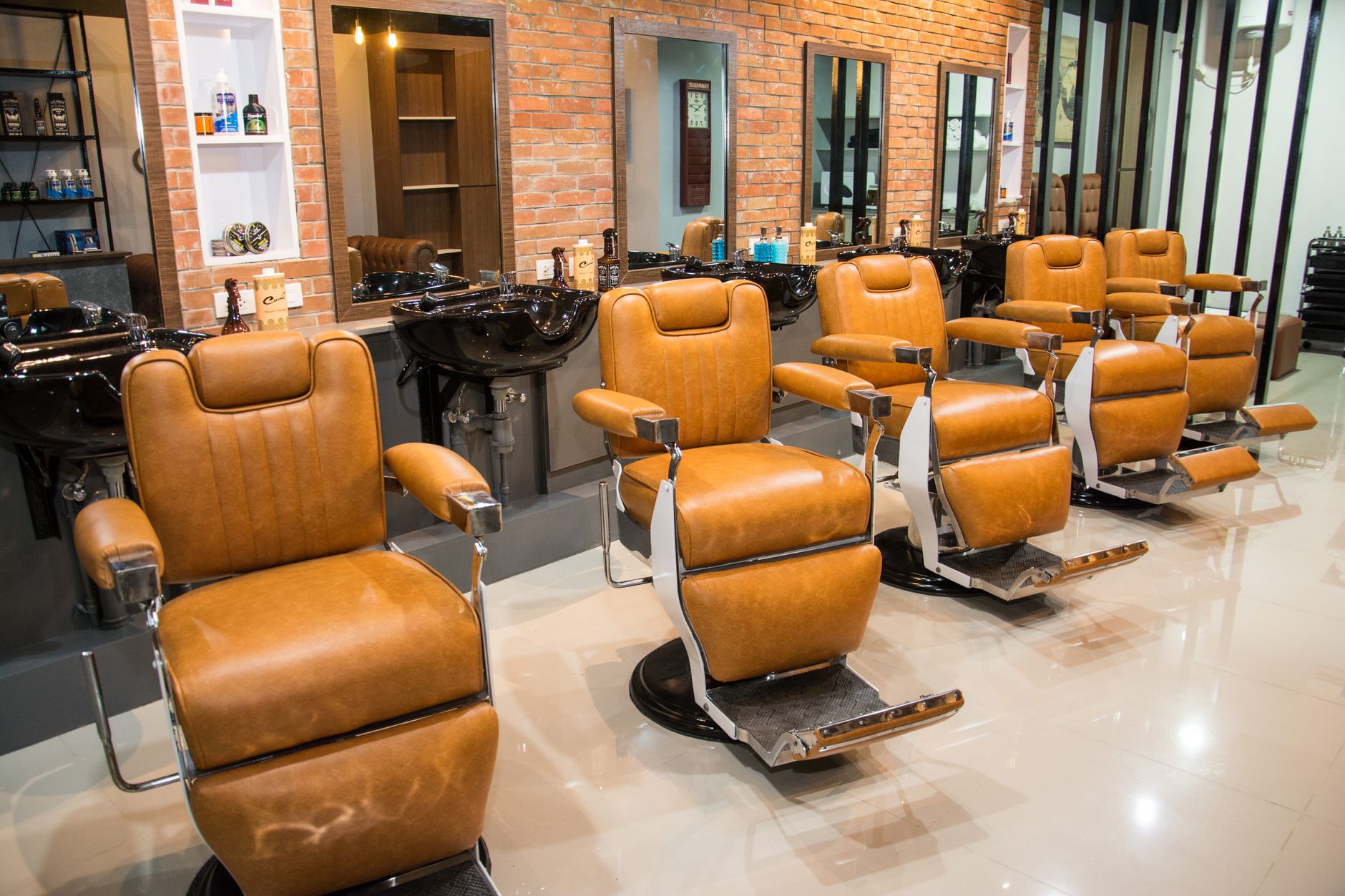 brown leather barbers chairs in a barber shop