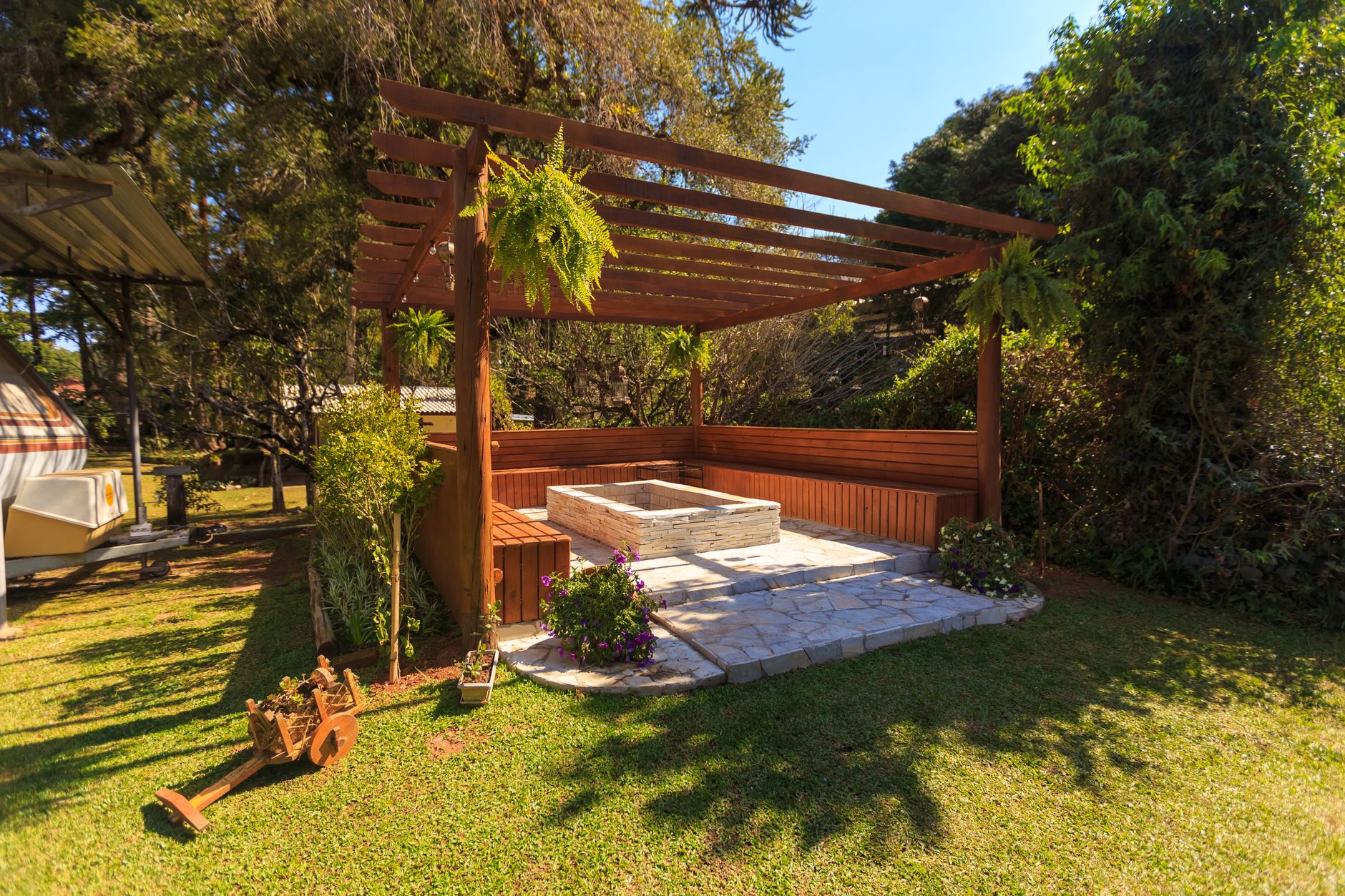brown wooden gazebo near green grass field