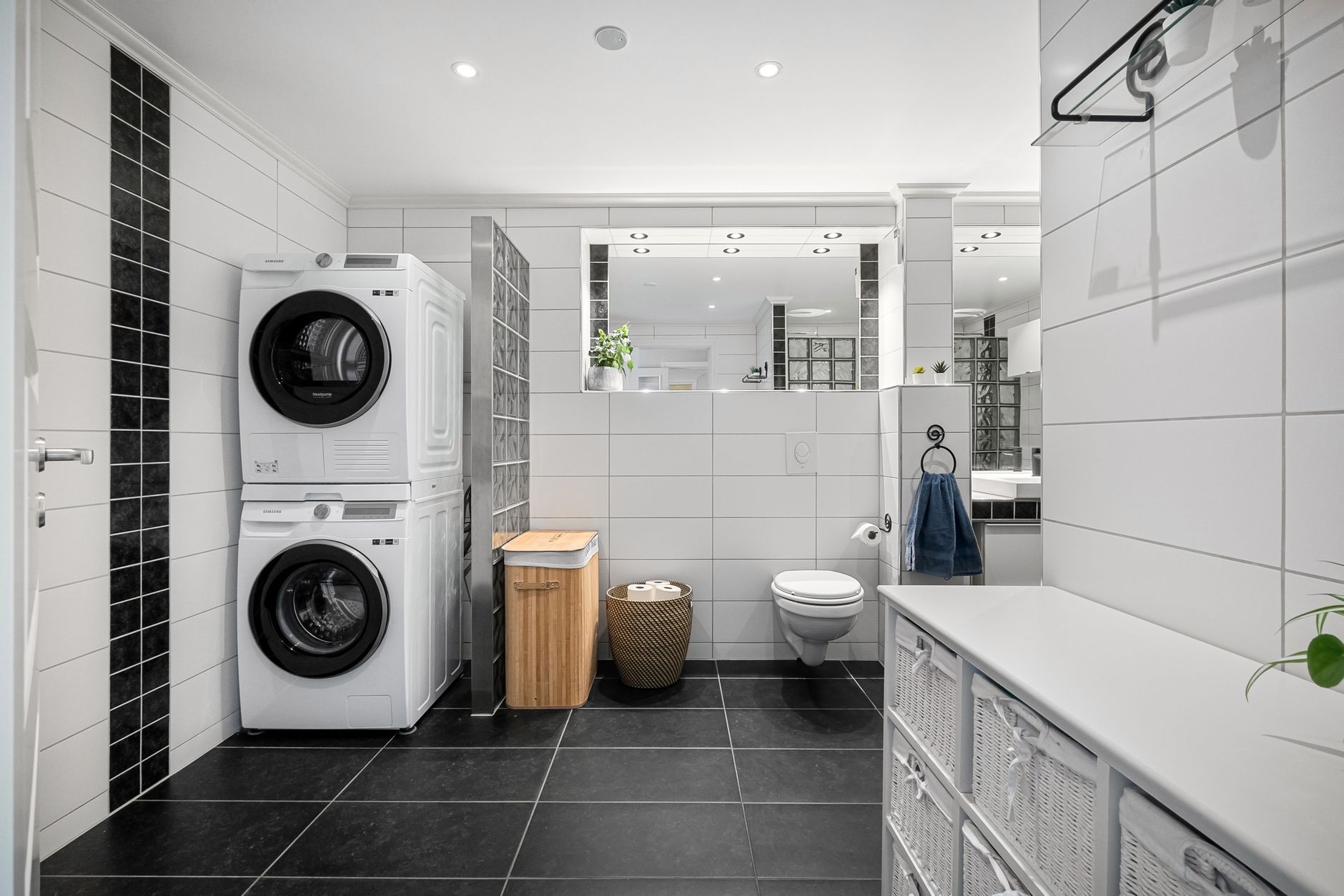 modern bathroom with washing and dryer machines