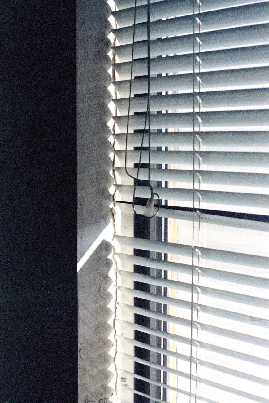 sunlight through window blinds creates lines