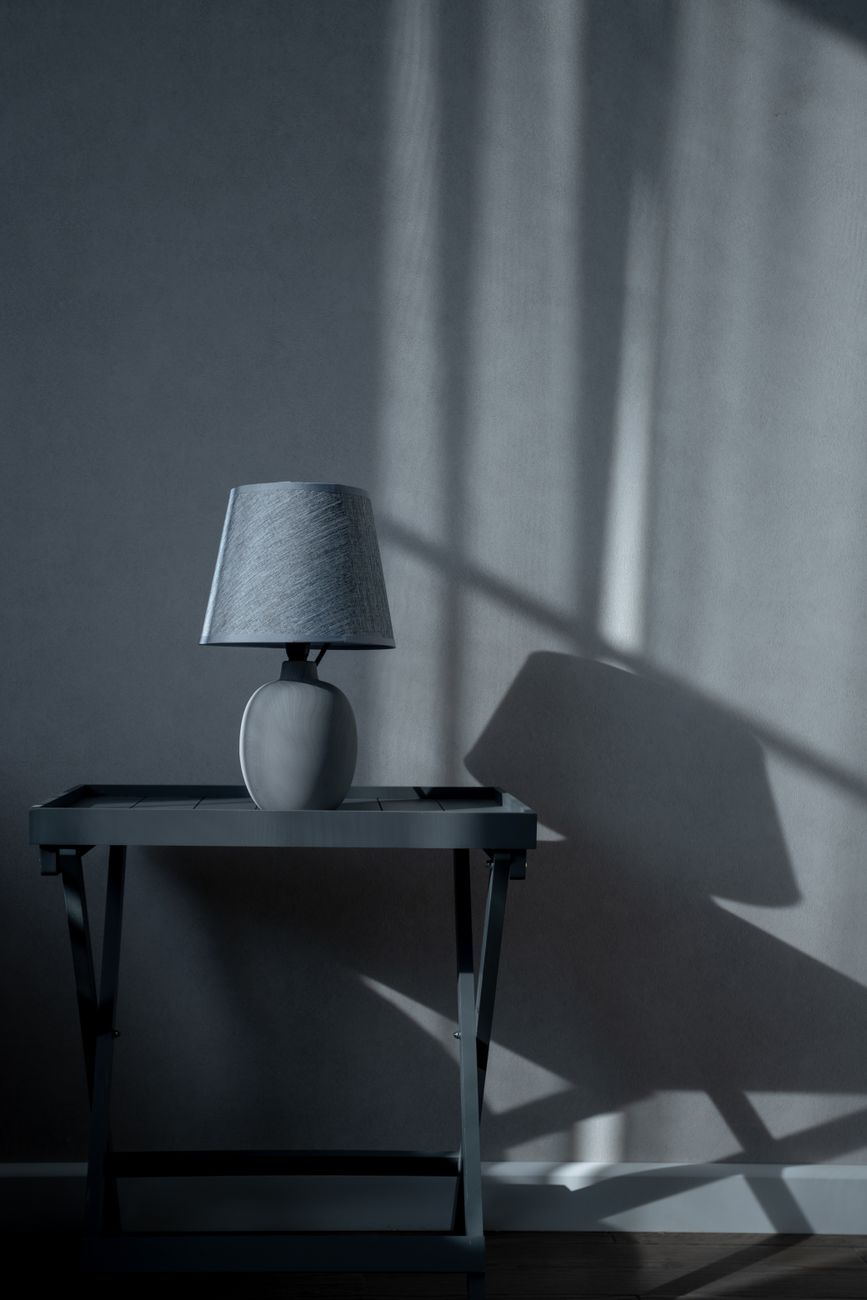 elegant table lamp with shadow in minimalist interior