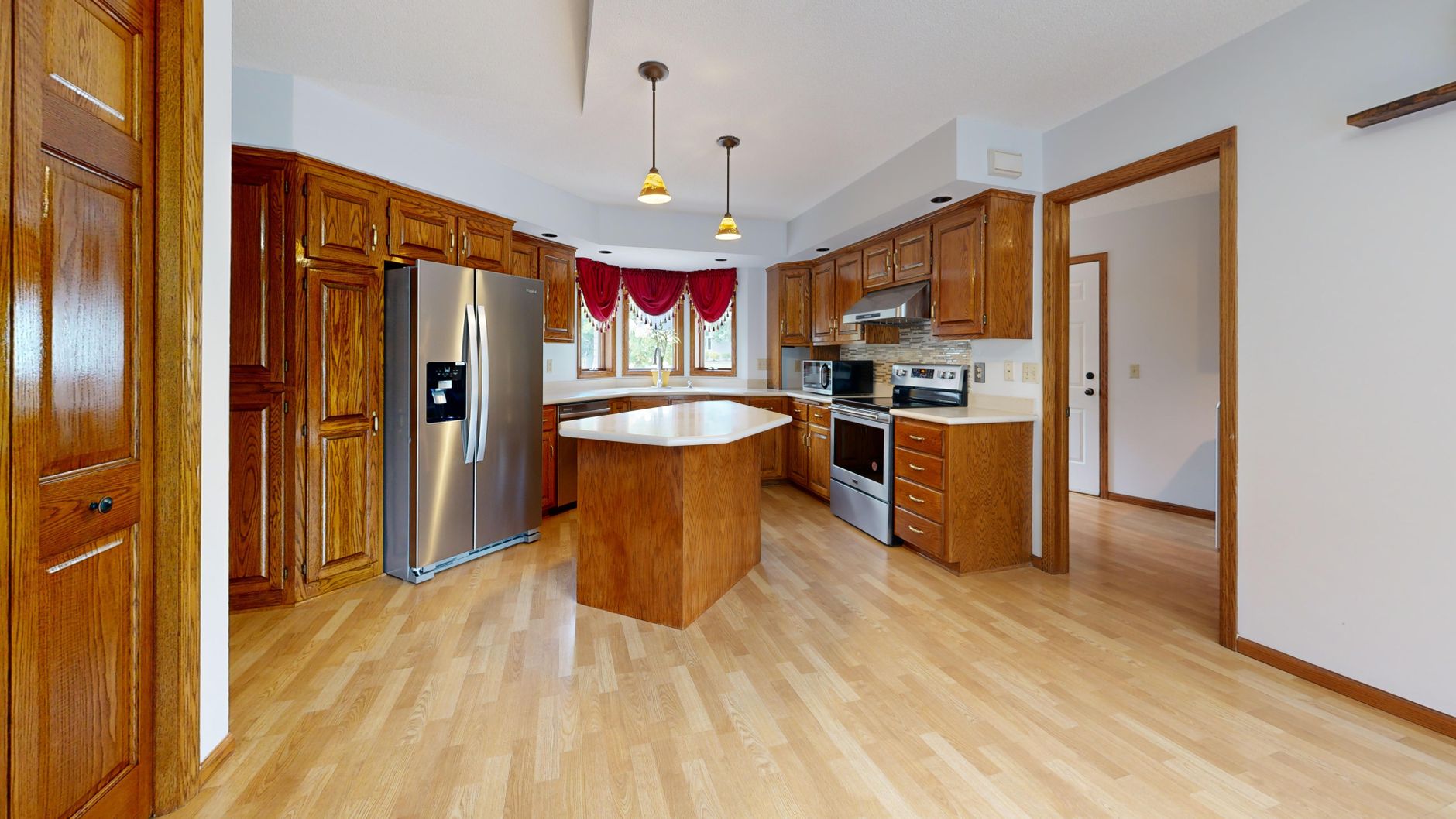 modern wooden kitchen with stainless steel appliances