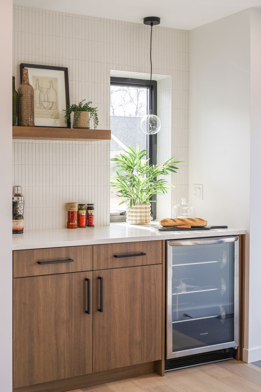 modern kitchen corner with wooden cabinets and decor