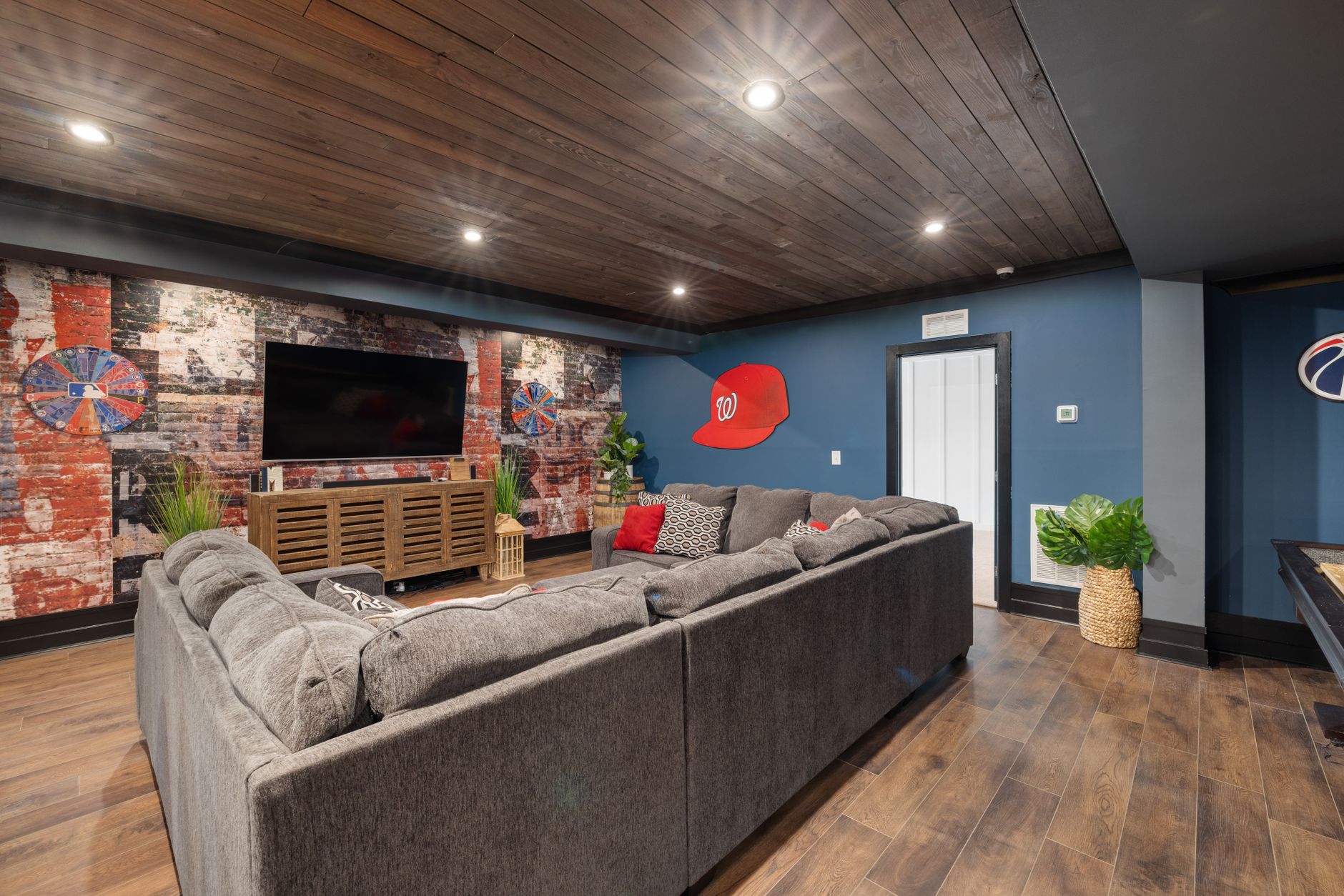 cozy basement room with modern decor and couch
