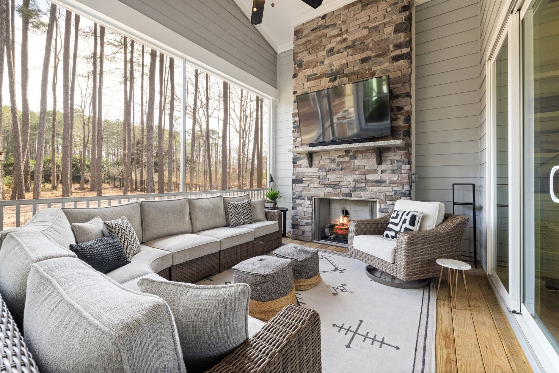 cozy outdoor patio with modern fireplace and furniture