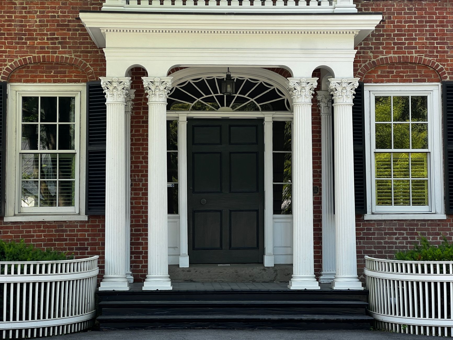 elegant colonial brick house entrance with columns