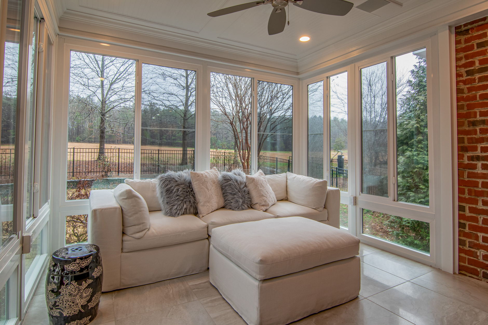 Cozy sunroom design with comfortable furniture