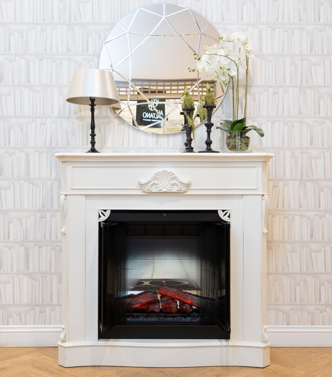a white fireplace with home decors