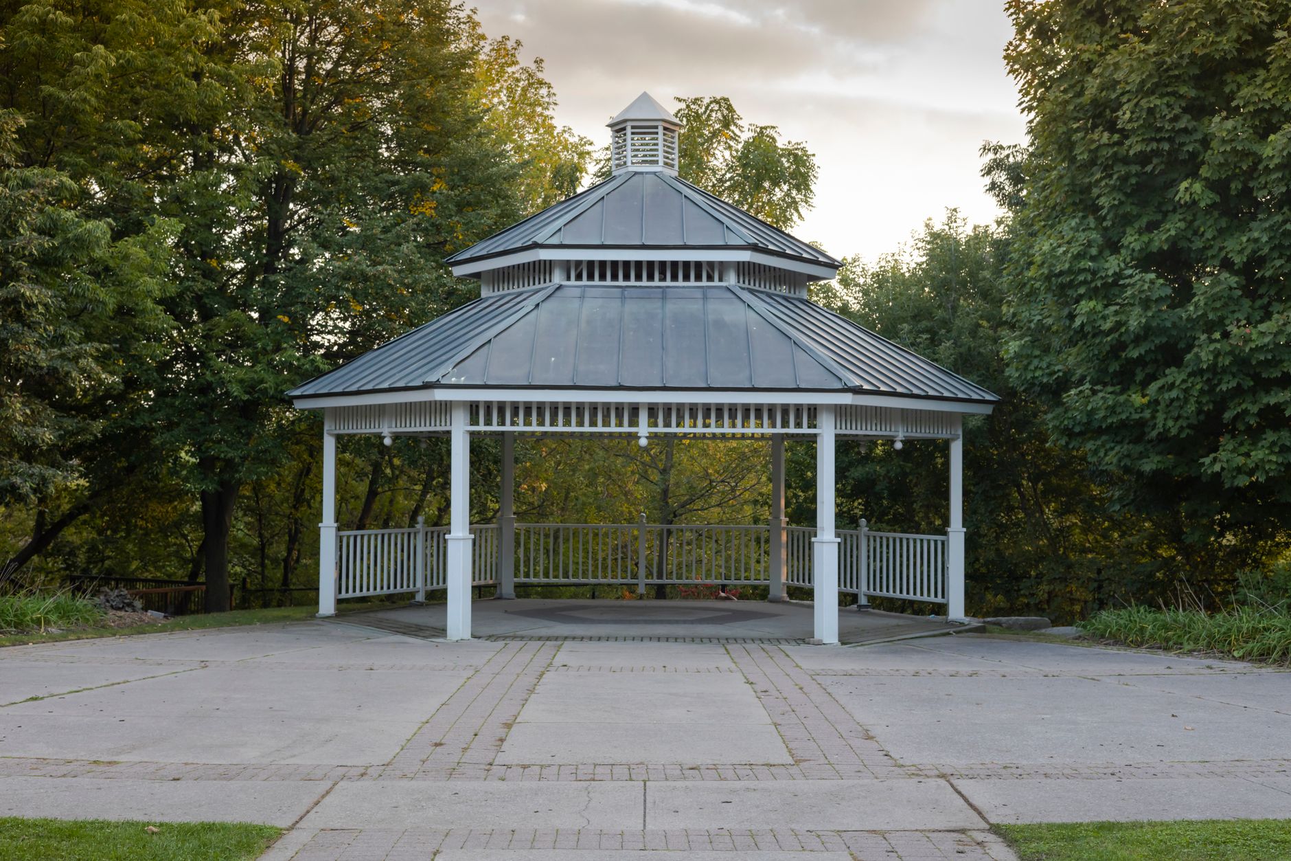wooden gazebo between trees