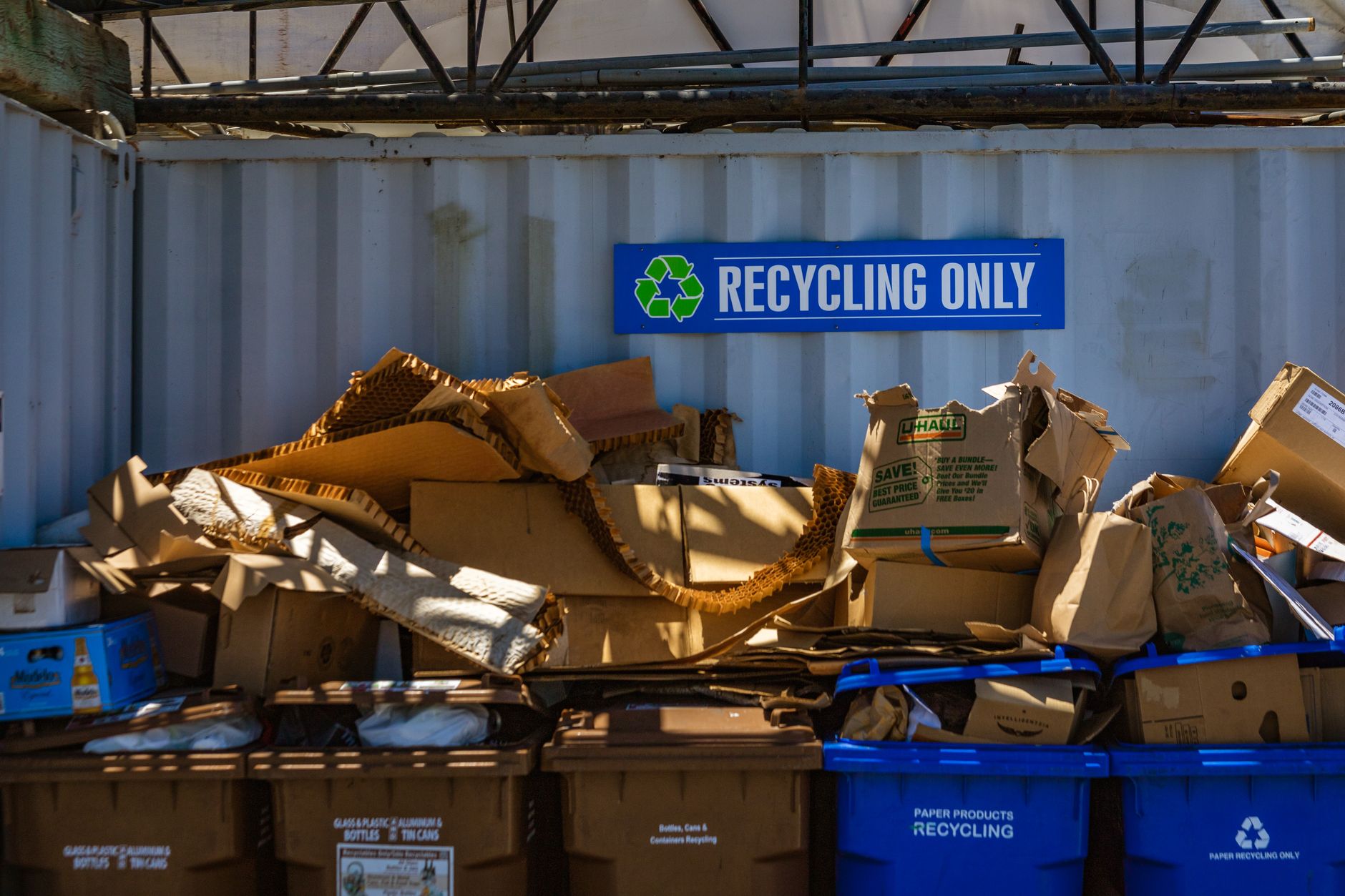 garbage containers with recycling only sign