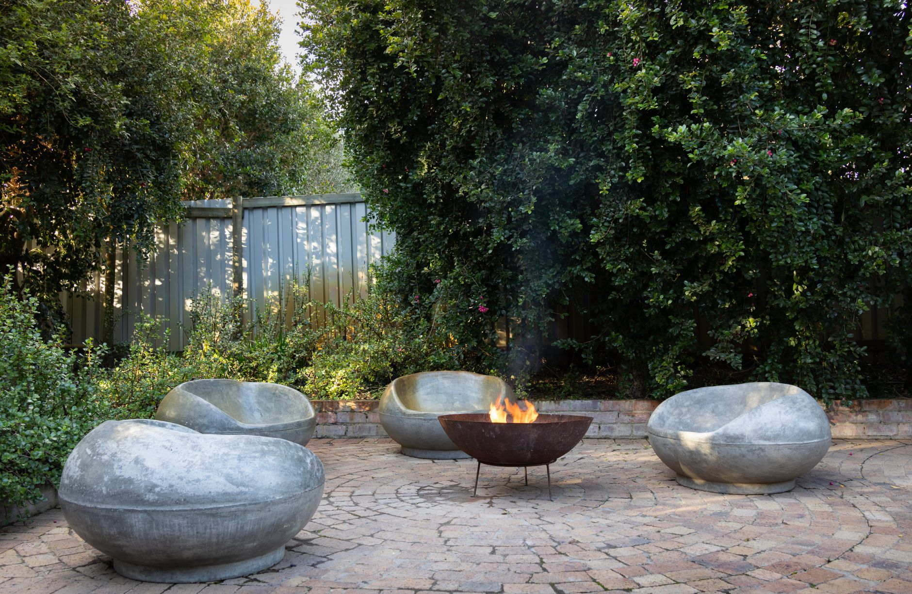tranquil outdoor fire pit with stone chairs