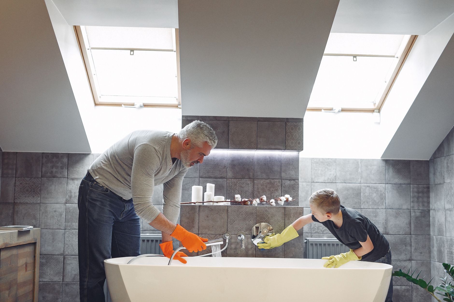 father and son cleaning bath together