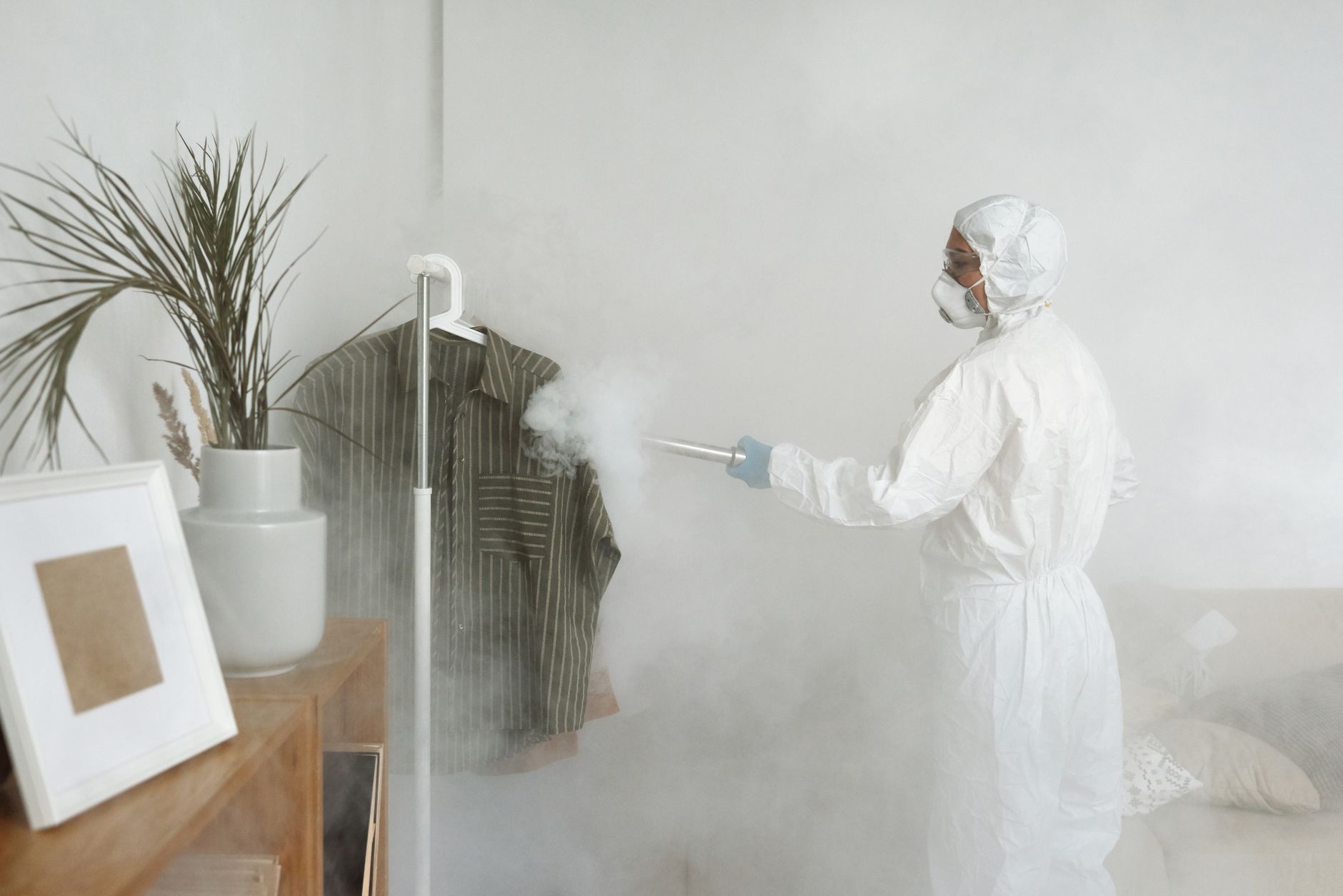 a woman disinfecting clothes