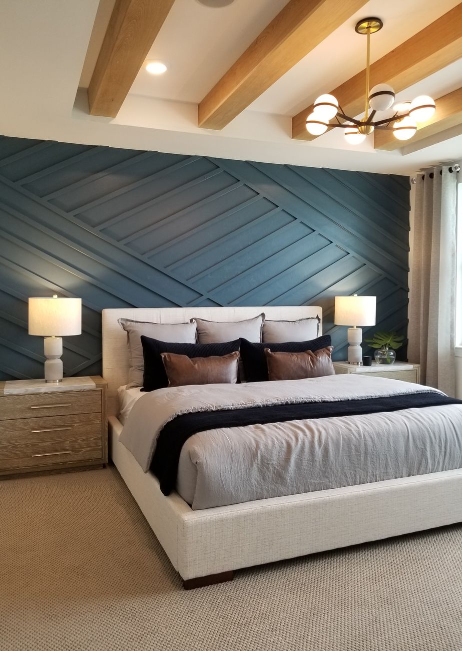 bedroom with blue accent wall