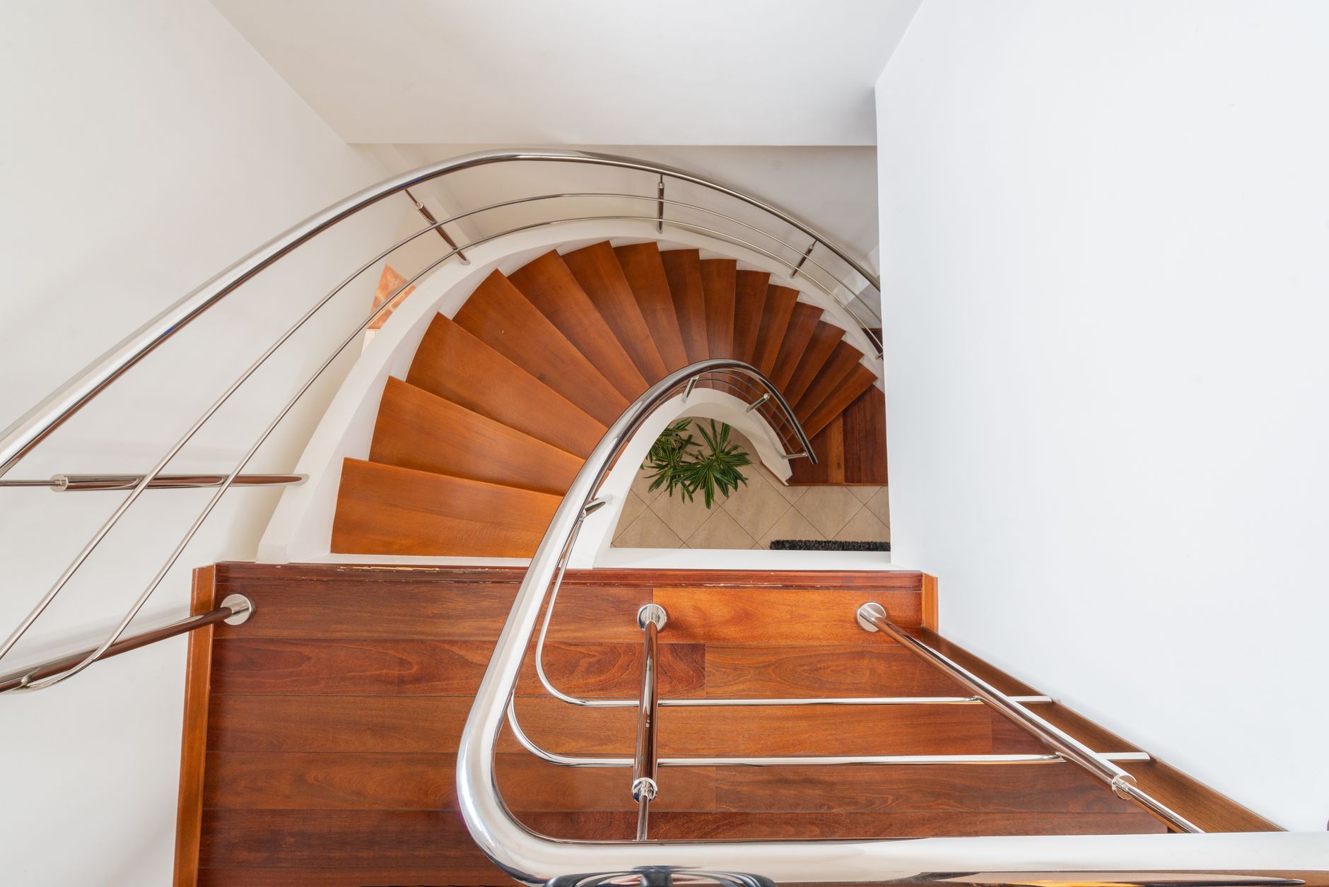 curved stairs with handrails in modern house
